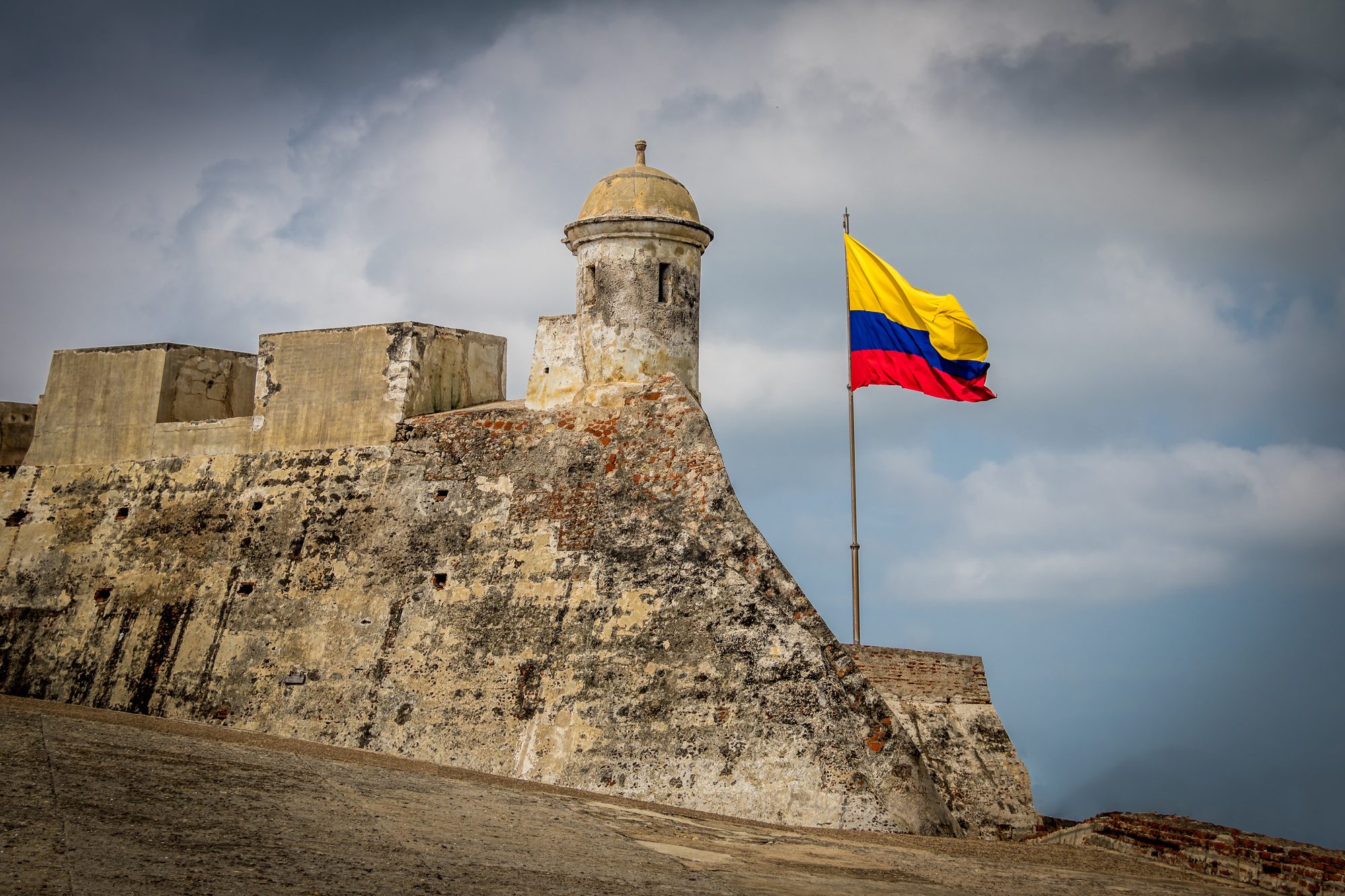 castillo de san felipe and colombian flag cartagena colombia