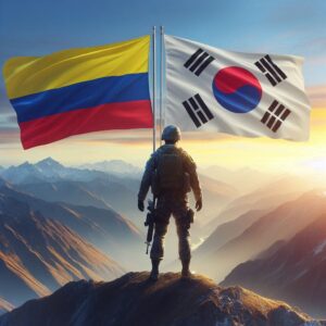 un soldado sosteniendo las banderas de Colombia y Sur Corea en la cima de una montana